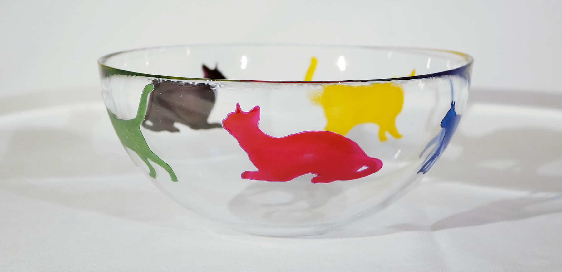 Cat in glass outlet bowl